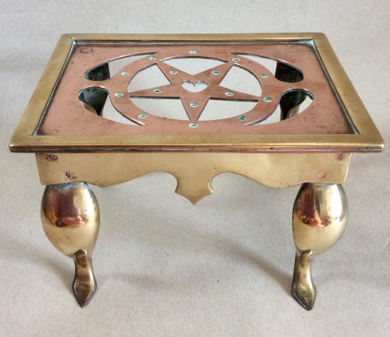 Small late Victorian/Edwardian pierced copper and brass Footman or Trivet.