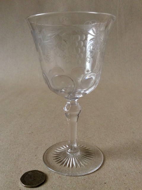 1950s engraved rock crystal style wine glass possibly by Thomas Webb & Sons. Unmarked.