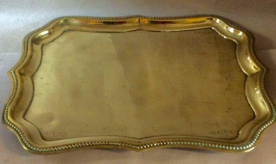 Victorian pressed brass tray with wavy edge an flower decoration to centre.