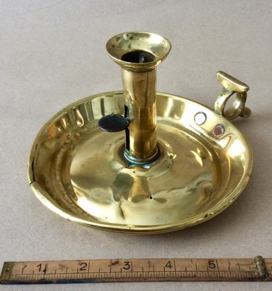 Lot 324 - An 18th century brass chamberstick