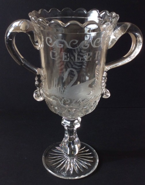 Antique clear pressed and engraved  glass Celery vase  with applied strap handles (trophy shape)