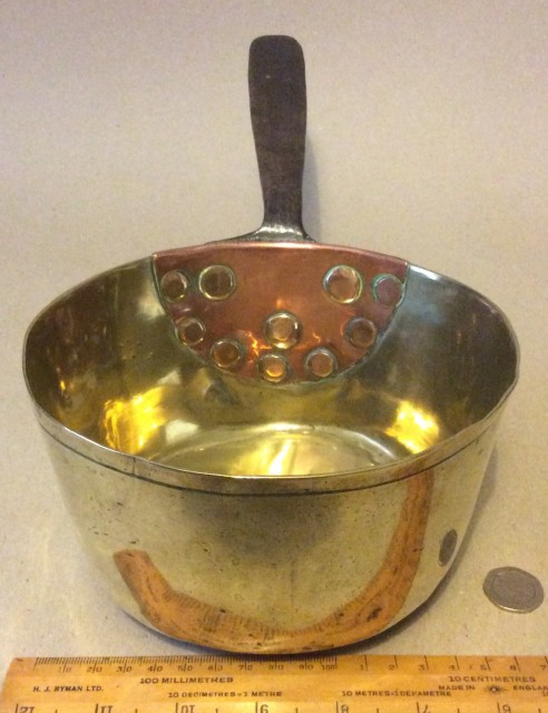 Antique early early 19th century brass saucepan with old repair to handle.