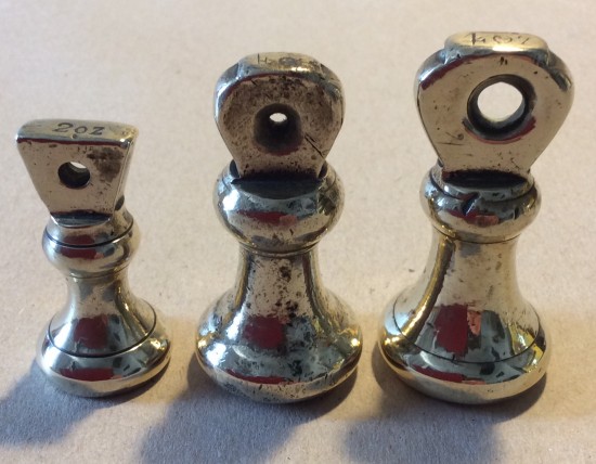 Two 4Oz and one 2Oz brass crown bell weights.