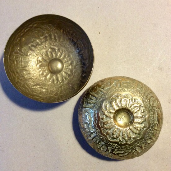Pair of early C20 Indian engraved and chased brass begging bowls