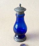 Blue pressed glass pewter mounted pepper pot.
