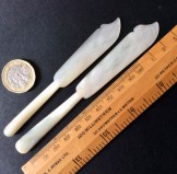 Two mother of pearl butter knives matched but different sized