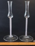 Pair of unusual opaque twist tulip glasses with folded feet.
