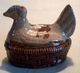 Hen on nest pottery money box