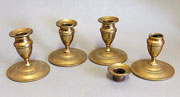 Set of four brass lantern candle sticks with detachable sconces.