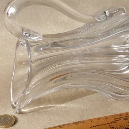 Detail: Antique early 19th century clear glass hand blown jug with applied handle.