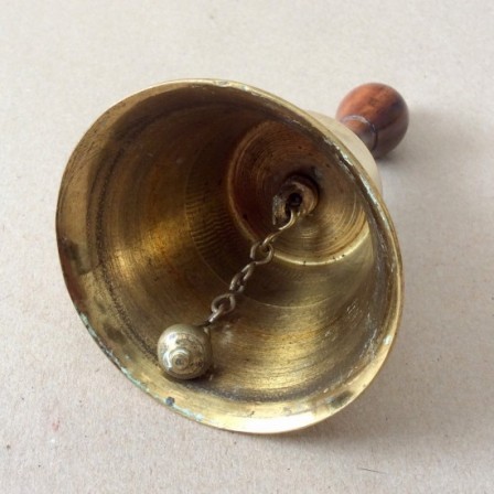 Detail: Antique Victorian brass table bell with turned yew wood handle 