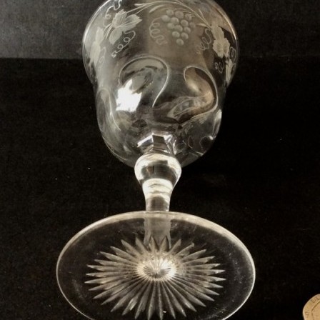 Detail: 1950s engraved rock crystal style wine glass possibly by Thomas Webb & Sons. Unmarked.