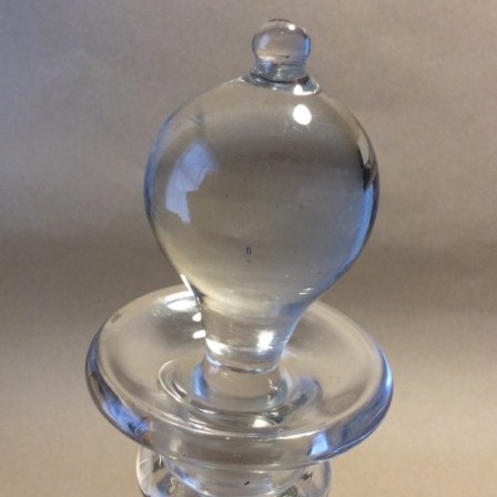 Detail: Antique  3/4 ring decanter with ten sides.