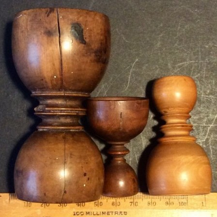 Detail: Antique treen apothecary measures.