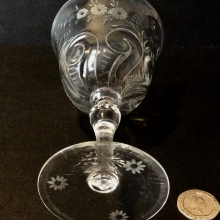 Detail: 1950s rock crystal style engraved wine glass. Poss. Thomas Webb & Sons
