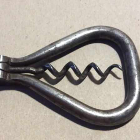 Detail: Victorian steel folding bow pocket corkscrew.