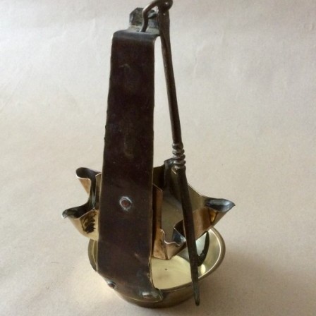 Detail: Antique sheet brass adjustable Crusie oil  lamp with five wick holders.