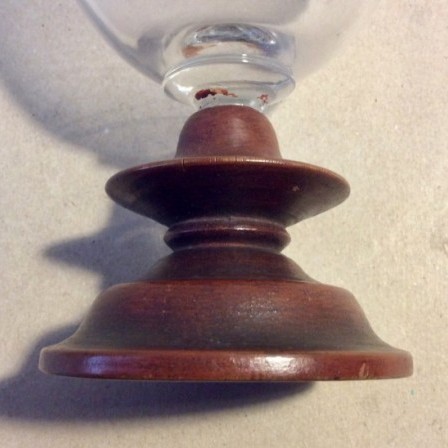 Detail: Antique glass goblet with painted treen replacement foot.