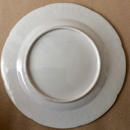 Detail: Antique porcelain press moulded German flower plate.