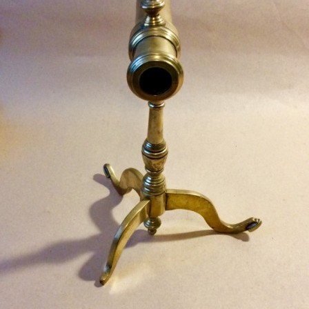 Detail: Antique Victorian brass goffering iron on tripod base.