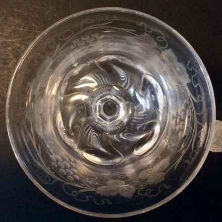 Detail: 1950s engraved rock crystal style wine glass possibly by Thomas Webb & Sons. Unmarked.