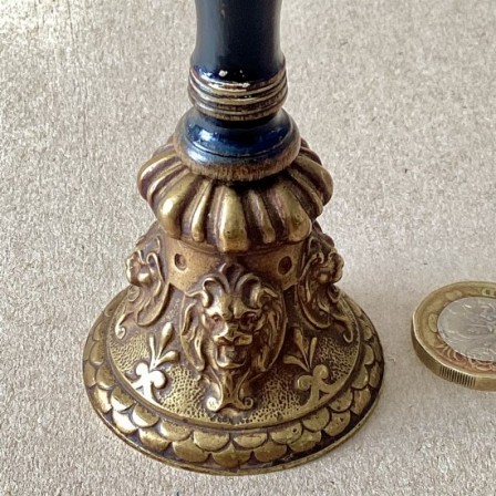Detail: Antique cast brass table bell.