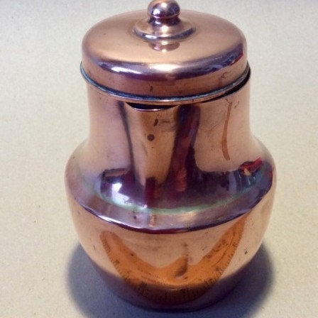 Detail: Antique copper lidded baluster milk?  jug.