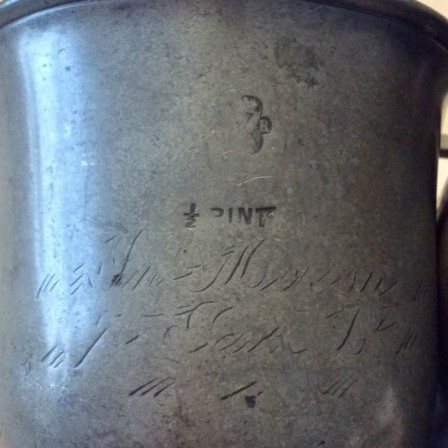 Detail: Two late Georgian 1/2 pint pewter tankards.