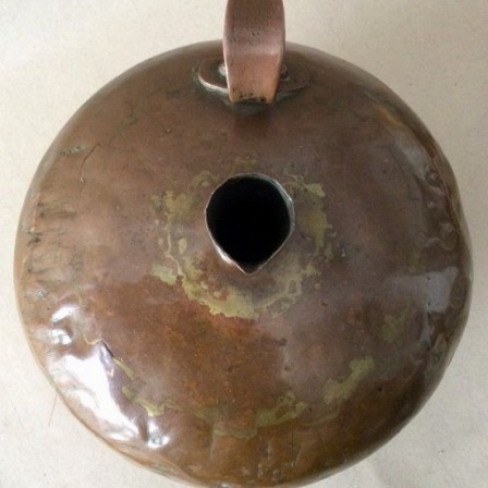 Detail: Antique 18th century Dutch copper flagon or pitcher.