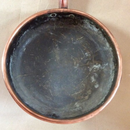 Detail: Victorian copper sauté pan. 30cm diameter.