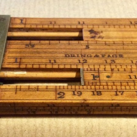 Detail: Antique Dring and Fage boxwood Customs and Excise double slide rule.
