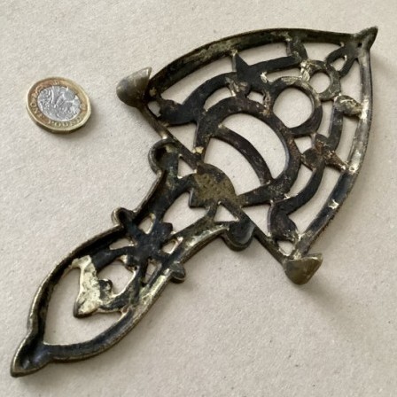Detail: Antique cast brass flatiron trivet 