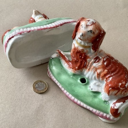 Detail: Antique pair of Staffs pottery inkwells, Spaniels on green cushions.