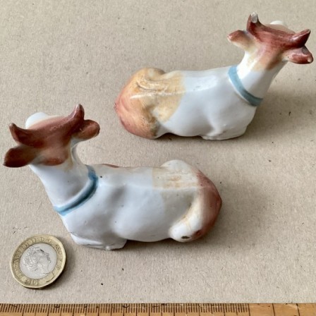 Detail: Antique pair of Victorian porcelain cow ornaments. C1890