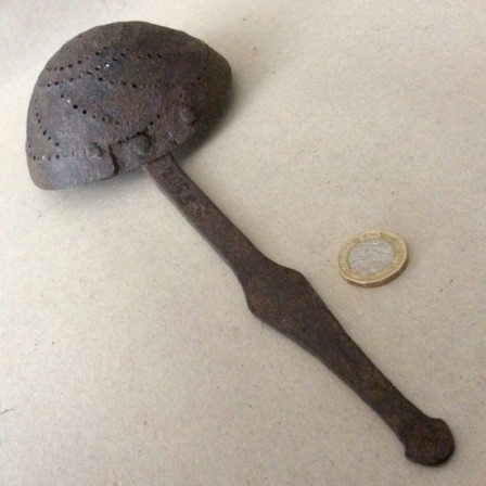 Detail: Antique wrought iron sieve or skimmer