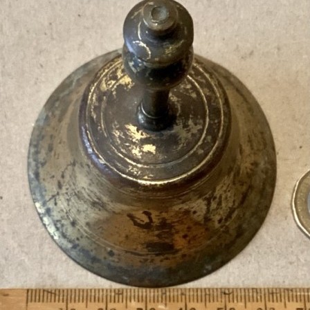 Detail: Antique brass table bell