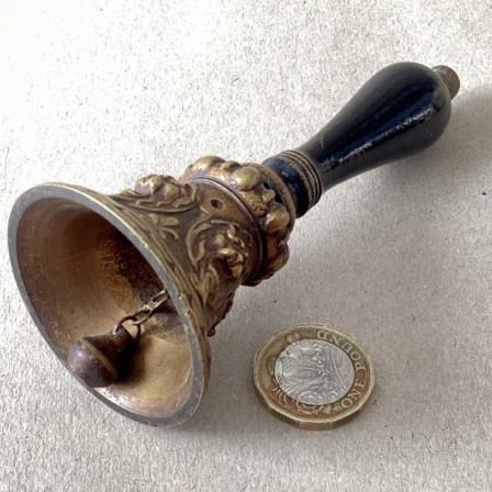 Detail: Antique cast brass table bell.