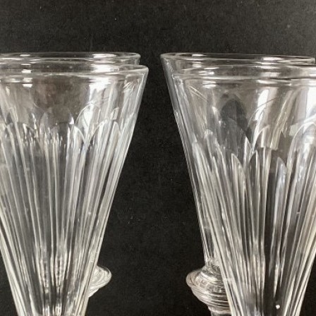 Detail: 4 Antique Georgian ale glassses, petal cut bowl over knopped stem and plain foot.