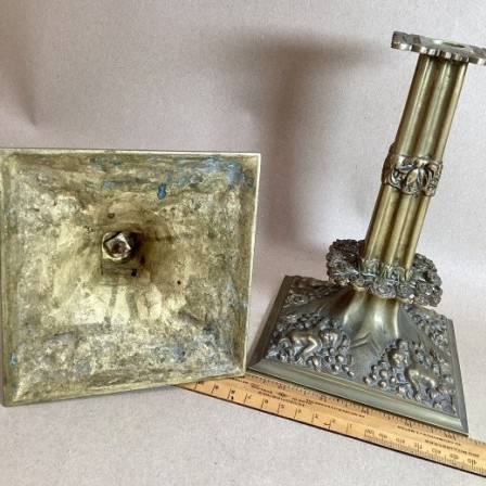 Detail: Pair of antique 17th century style brass candlesticks circa 1920