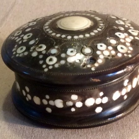 Detail: Round cow horn  inlaid snuff box.