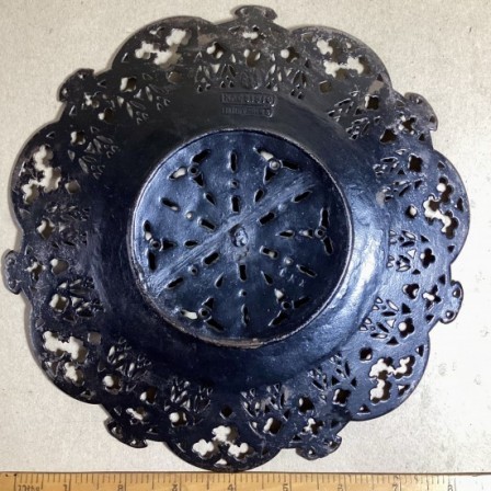 Detail: Antique Russian cast iron decorative pierced plate. 8.6in diameter.