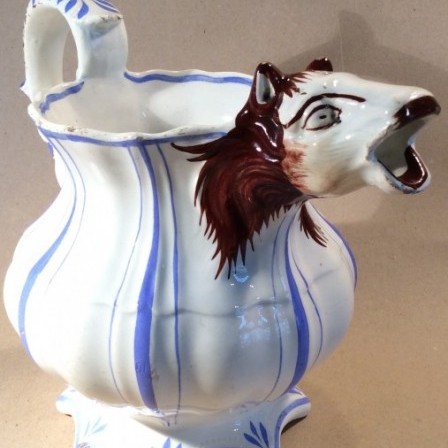Detail: Victorian pottery jug with horse head spout.