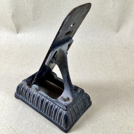 Detail: Antique cast iron and enamel kitchen thermometer