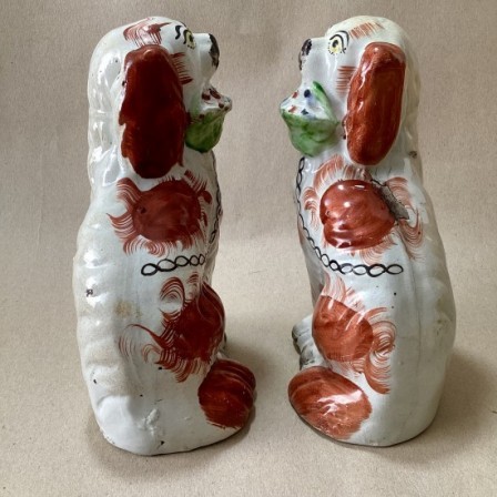Detail: Antique pr. of Staffordshire spaniels with baskets.