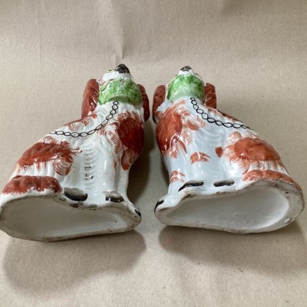 Detail: Antique pr. of Staffordshire spaniels with baskets.